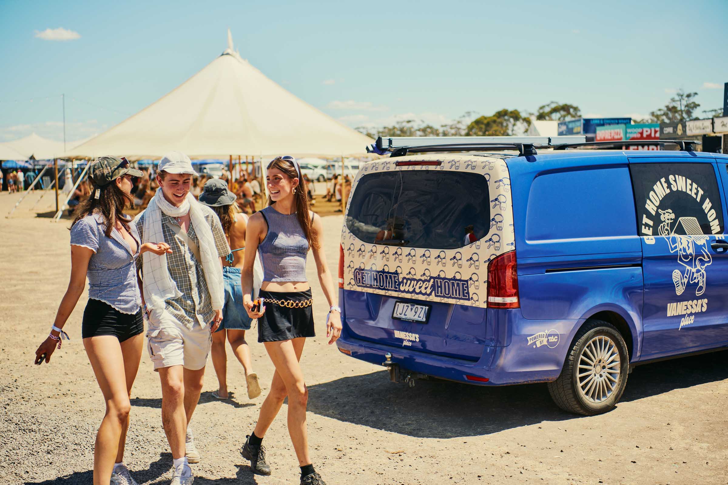 Young people walking past the Vanessa bus