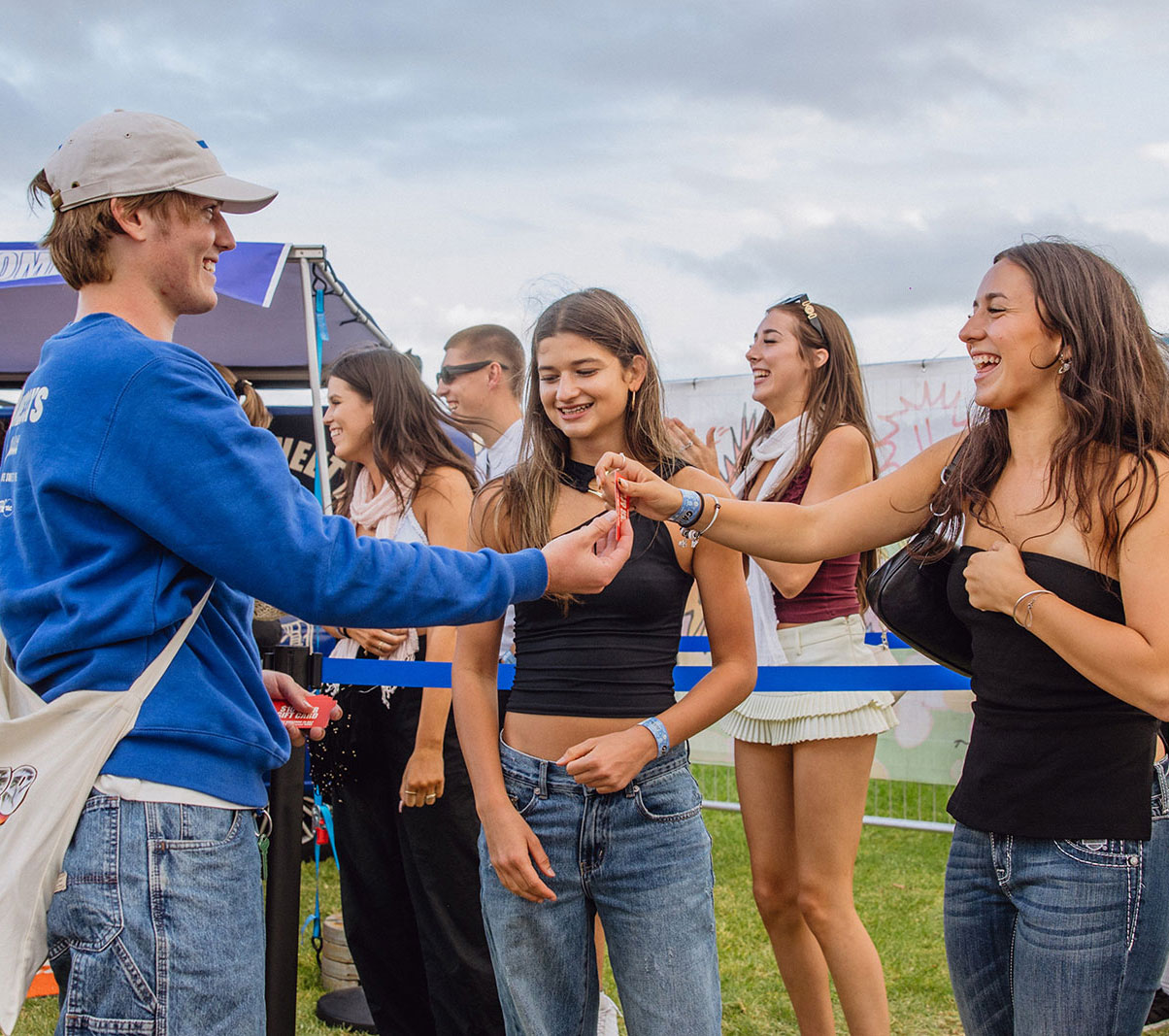 Staff member handing out flyer